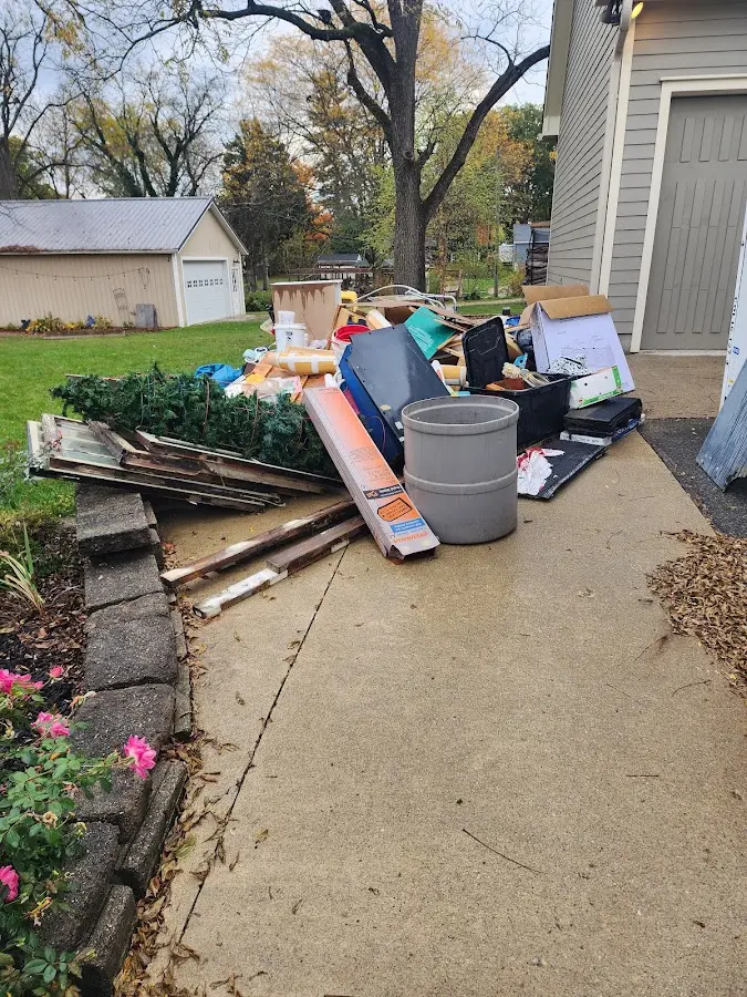 Dumpster being loaded with debris for 30 Yard Dumpster Rental in Mattapoisett